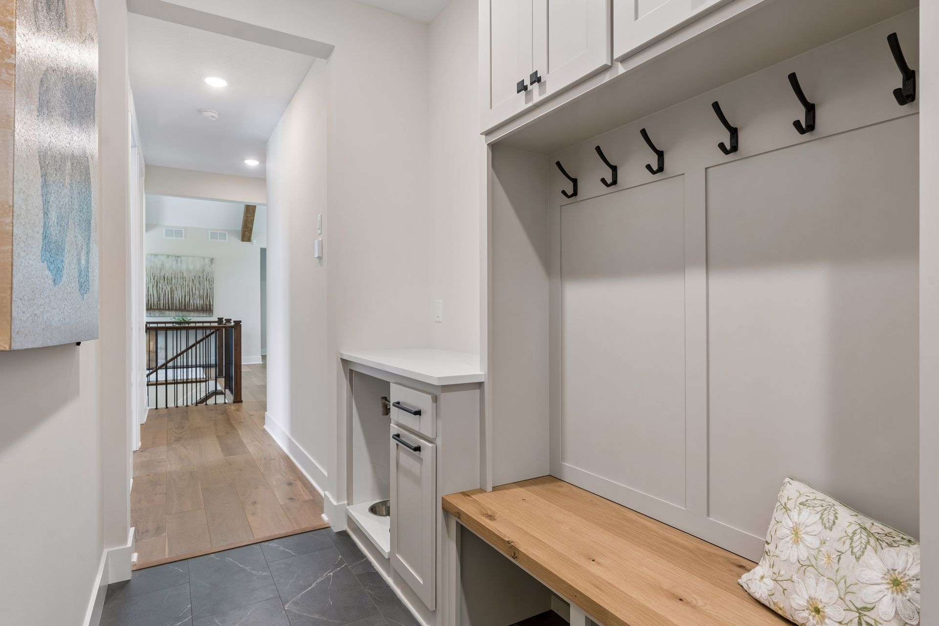 Custom mudroom with built-in bench, storage lockers and coat hooks